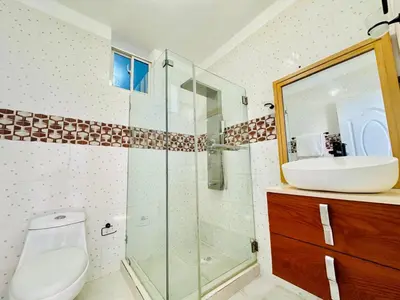 a bathroom with a toilet and a sink and a shower at Apartartamento cabarete in Cabarete