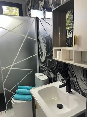 a bathroom with a sink and a toilet and a mirror at Apartamento Entre Playas 2- 3 pax, 4 min de la playa in Las Galeras