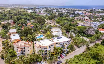an aerial view of a city with houses and trees at nNomad Apartment steps to Sirena - Apartment in Sosúa