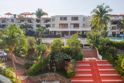 an aerial view of a resort with palm trees and stairs at nNomad Studio mins from Sirena - Apartment in Sosúa