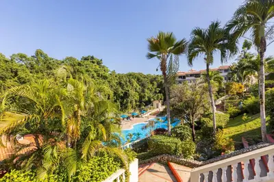 an aerial view of a resort with a pool and palm trees at nNomad Studio mins from Sirena - Apartment in Sosúa