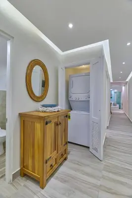 a bathroom with a sink and a mirror on the wall at Costa Del Sol Juan Dolio 2BR Sunset, Beach Front in Juan Dolio