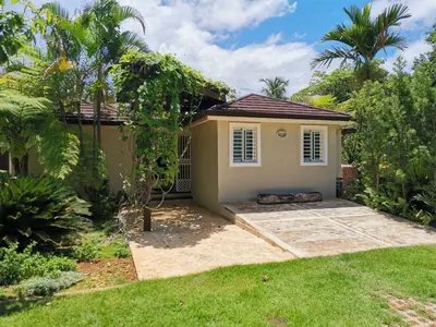 a small house with a lawn in front of it at Family Villa at Las Galeras, Samaná in Las Galeras