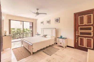 a bedroom with a bed and a balcony at Apartment with 2bedrooms in Portillo Residences in Las Terrenas