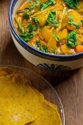 a bowl of soup and a bowl of tortilla chips at Ki-Ra Holistic Living in Boca de Chavón