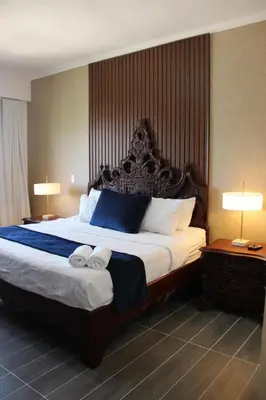 a bedroom with a large bed with two towels on it at Acogedor y Moderno apartamento en Evaristo Morales in Colorado