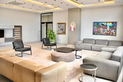 a living room with a couch and chairs and a table at Acogedor y Moderno apartamento en Evaristo Morales in Colorado