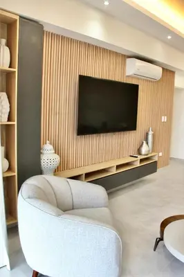 a living room with a tv and a couch and a chair at Acogedor y Moderno apartamento en Evaristo Morales in Colorado