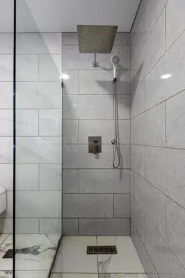 a bathroom with a shower with a glass door at PERLA I -Modern Private Villa - 4 Bedrooms with Pool in Sosúa