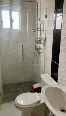 a bathroom with a shower and a toilet and a sink at Lujosa Villa in Río San Juan J in Río San Juan