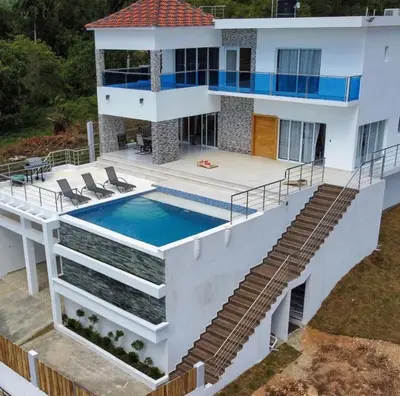 an aerial view of a house with a swimming pool at Lujosa Villa in Río San Juan J in Río San Juan
