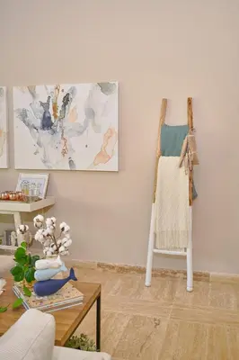 a living room with a table and a painting on the wall at ®{The~Beach~View} @PlayaBonita BeachfrontPool in Las Terrenas