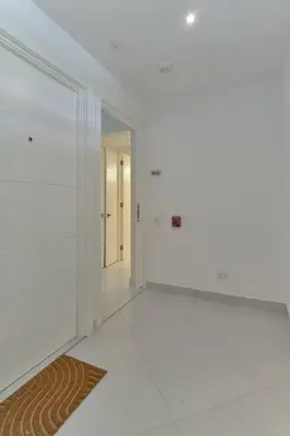 a white room with a hallway with a mirror at Aquarella Caribbean Paradise Playa Juan Dolio in La Puntica de Juan Dolio
