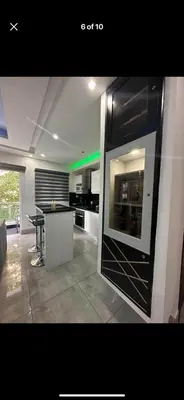 a kitchen with a counter and a table in a room at Soja 11 in Santiago de los Caballeros