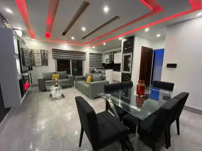 a living room with a glass table and a couch at Soja 11 in Santiago de los Caballeros