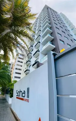a building with the logo of one iii hotels at Soja 11 in Santiago de los Caballeros