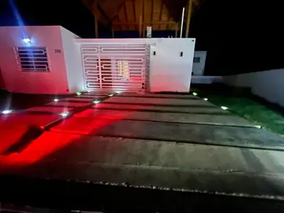 a set of stairs leading to a building with red lights at The Ocean Romana in La Romana