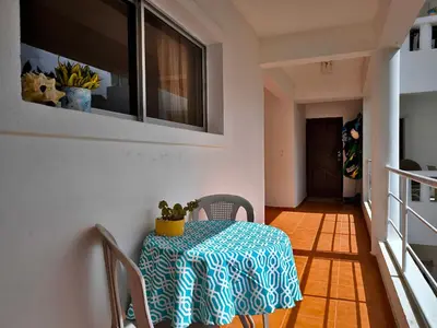 a table with a blue and white table cloth on it at Chilvers Seaside Studio 202 in Cabarete
