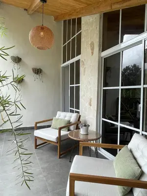 a patio with two chairs and a table at Villa Linda in Polo