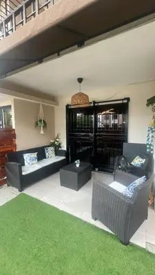 a living room with couches and a green lawn at Luxurious and comfortable 1 level in Ensanche Savica de Mendoza