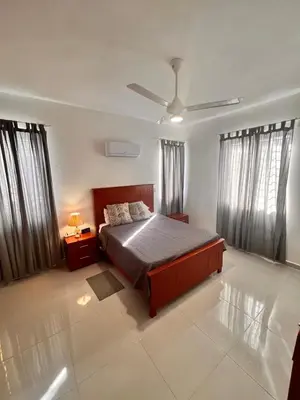 a bedroom with a bed and a ceiling fan at Popsy Villa 3 Bedrooms with Pool in Puerto Plata