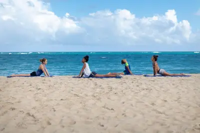 a group of women sitting on the beach at Viva Heavens by Wyndham, A Trademark All Inclusive in San Felipe de Puerto Plata