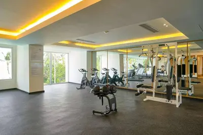 a gym with treadmills and exercise bikes in a room at Beachfront FL21 Con Tina Aquarella in La Puntica de Juan Dolio