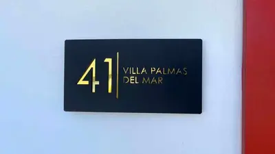 a sign on a wall with the number fourventhventh at Unique 3 Bedrooms Villa las Palmas 41 in Puerto Plata