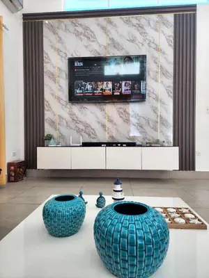 a living room with two large blue vases on a table at Unique 3 Bedrooms Villa las Palmas 41 in Puerto Plata