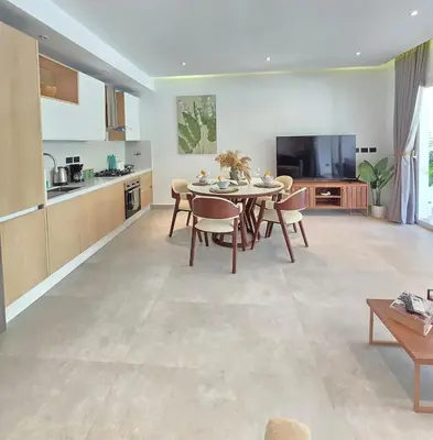 a kitchen and living room with a table and chairs at Margarita 102 Private Beach Access Aqua Esmeralda Dominicus in La Laguna