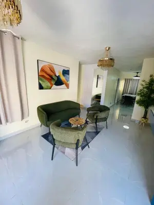 a living room with a couch and chairs and a table at Luxury apartment near Jumbo in San Pedro de Macorís