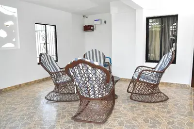 a group of three chairs sitting in a room at Yolanda's house in Bayaguana