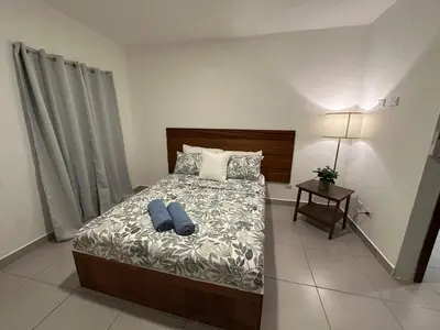 a bedroom with a bed with two pillows at Apartamento en La Romana buena vista norte Jacuzzi in La Romana