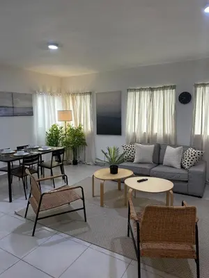 a living room with a couch and a table at Apartamento en La Romana buena vista norte Jacuzzi in La Romana