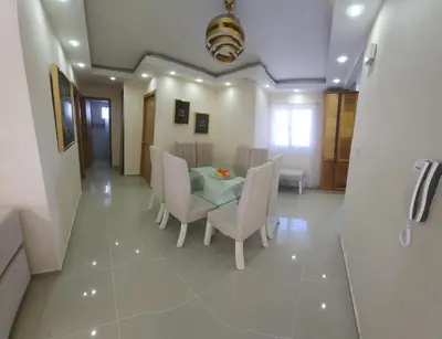 a dining room with a table and chairs at Apartamento in Santo Domingo