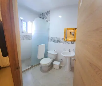 a bathroom with a toilet and a sink at Apartamento in Santo Domingo