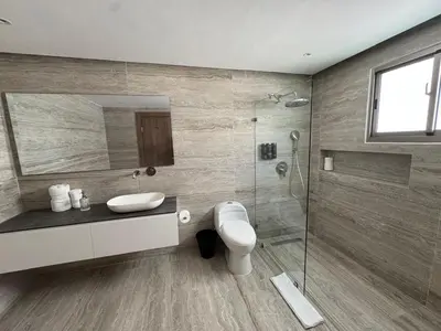 a bathroom with a toilet and a sink and a shower at Caonabo35 Elegancia Boutique en Santo Domingo1 in Santo Domingo