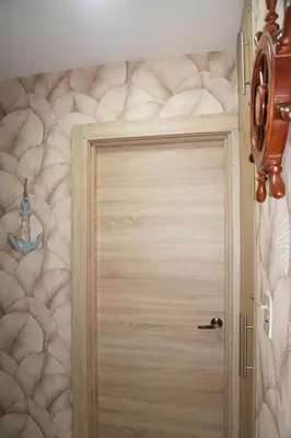 a wooden door in a room with a wall at Experience Coconut Paradise Apart O2 in San Cristóbal