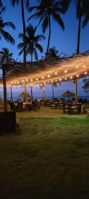 a group of picnic tables under a pavilion with lights at Casa Las Ballenas - 3 bedroom Las Terrenas in Las Terrenas