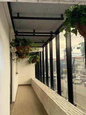 a balcony with potted plants on the side of a building at Caonabo35 Elegancia Boutique en Santo Domingo 5 in Santo Domingo