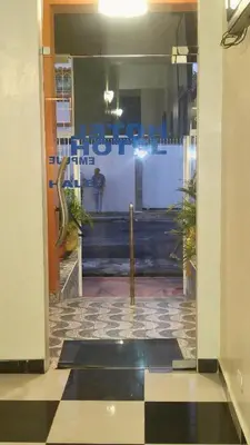 a doorway to a lobby with a person in a store at Hotel Gazcue in Santo Domingo