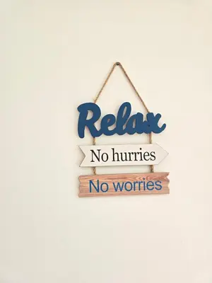 a sign that says relax no hurts no worries at Dominica 203 Luxury Apartment by Caribbean Beach Dominicus Aqua Esmeralda in Bayahibe