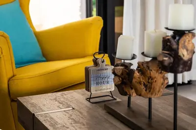 a living room with a table with candles and a couch at Newly built 2 bedroom 2 bath private pool villa! in Sosúa