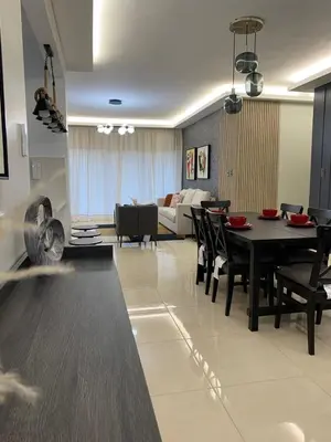 a living room with a table and chairs and a couch at La Elegancia in Canabacoa