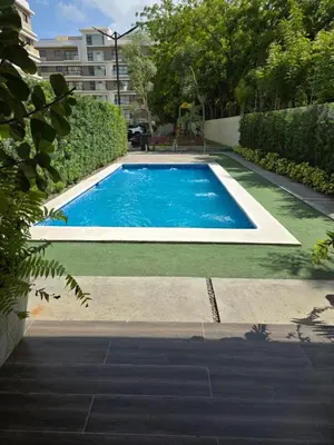 a swimming pool in the middle of a yard at La Elegancia in Canabacoa