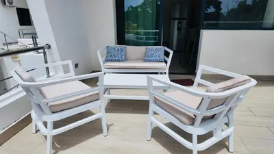two chairs and a table on a porch at MeliT in Las Terrenas