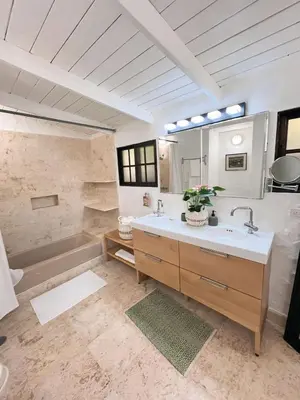 a bathroom with a sink and a tub at Private Suite in Casa de Campo in La Romana