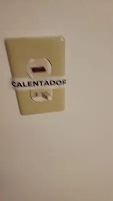 a lightswitch in a bathroom with the word sanitation on it at Apartamento Confortable Moderno Minimalista in Ciruelitos Arriba