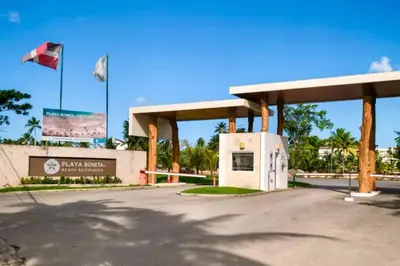 a gas station with a flag in front of it at Beachside Studio with Pool, Steps to Playa Bonita in Las Terrenas