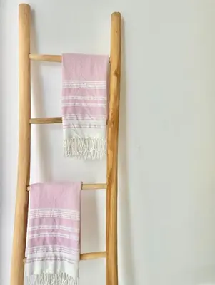 a wooden ladder with two towels on it at Beachside Studio with Pool, Steps to Playa Bonita in Las Terrenas